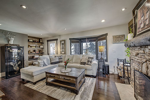 Living room with stone fireplace
