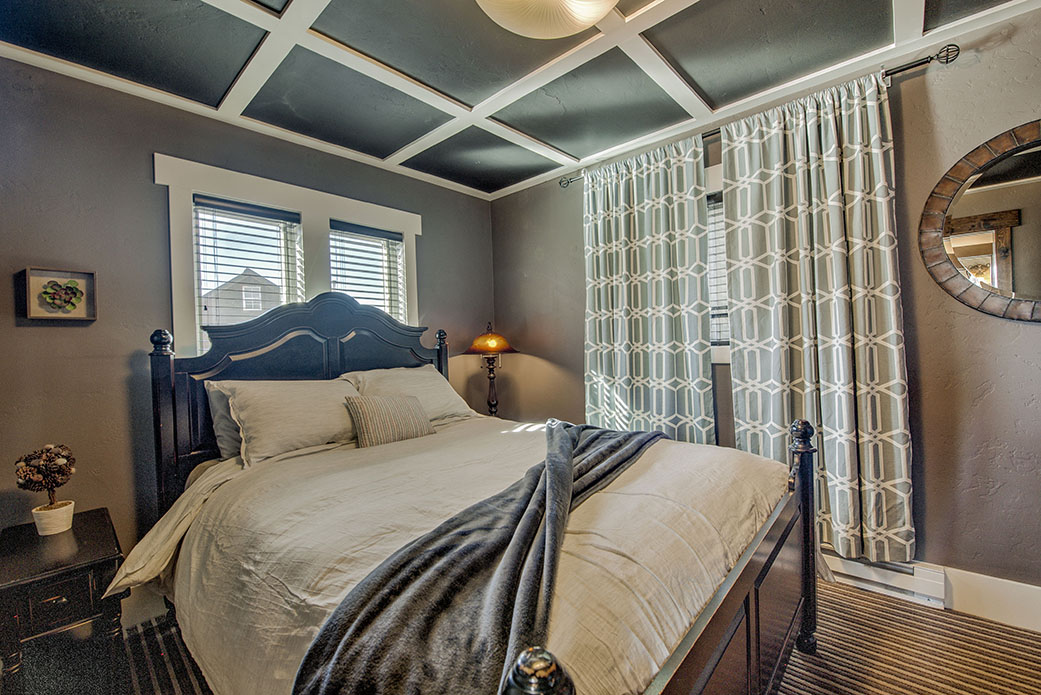 Queen bedroom with coffered ceiling, main floor