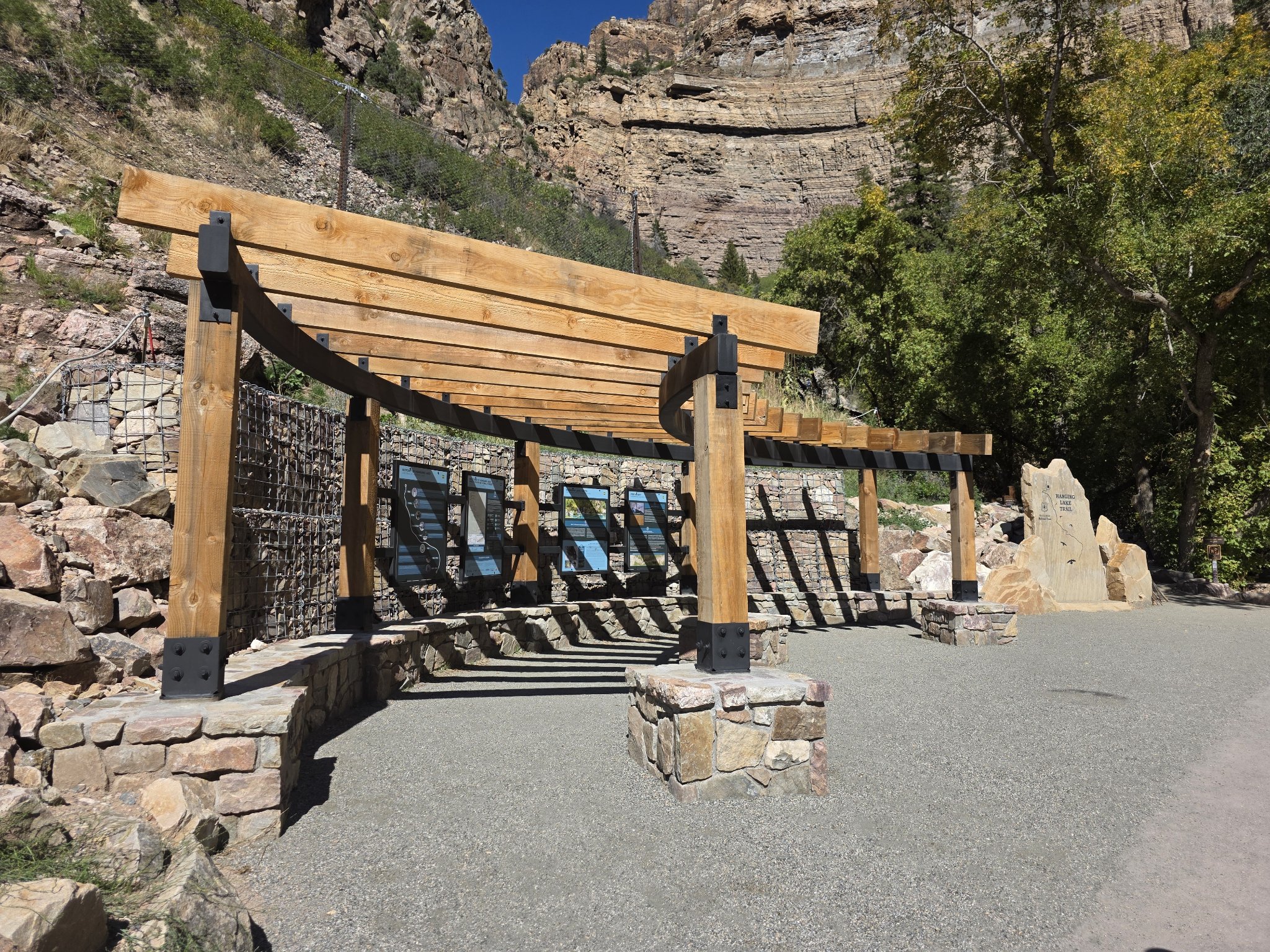 Shane and Michelle, your Keystone Cozy Retreat hosts, smiling at the Hanging Lake trailhead