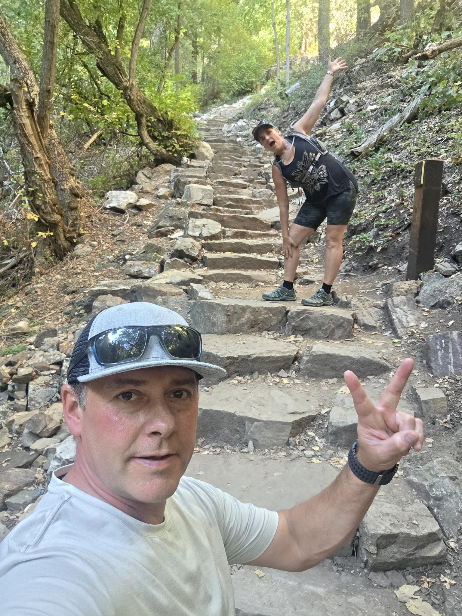 Shane and Michelle goofing around on the steep stone steps of the Hanging Lake trail