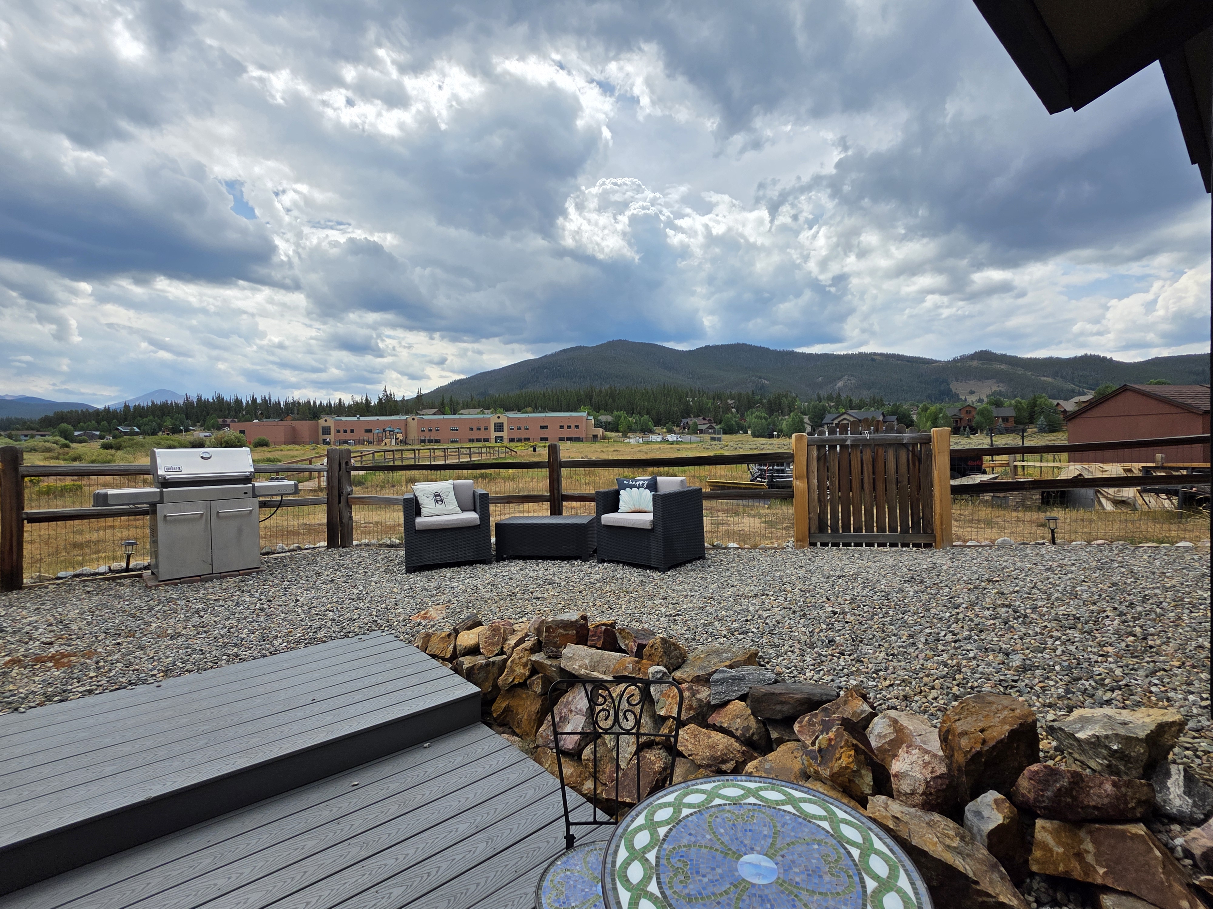 Suite deck with grill, seating and mountain views